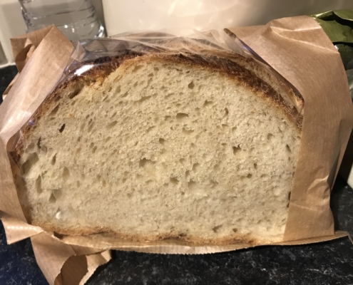 Soft white sourdough wrapped in paper bag